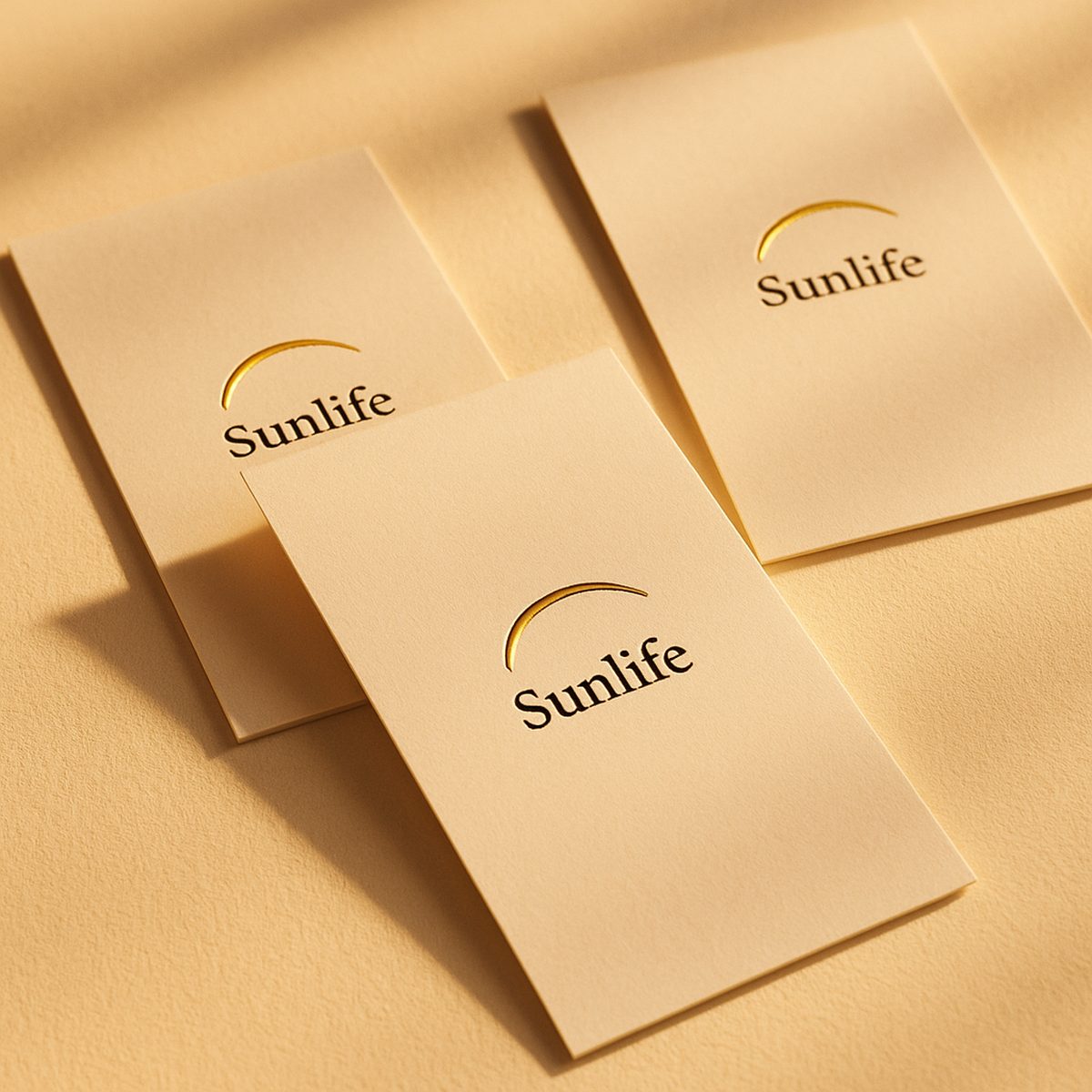 Gold foil business cards with Sunlife design